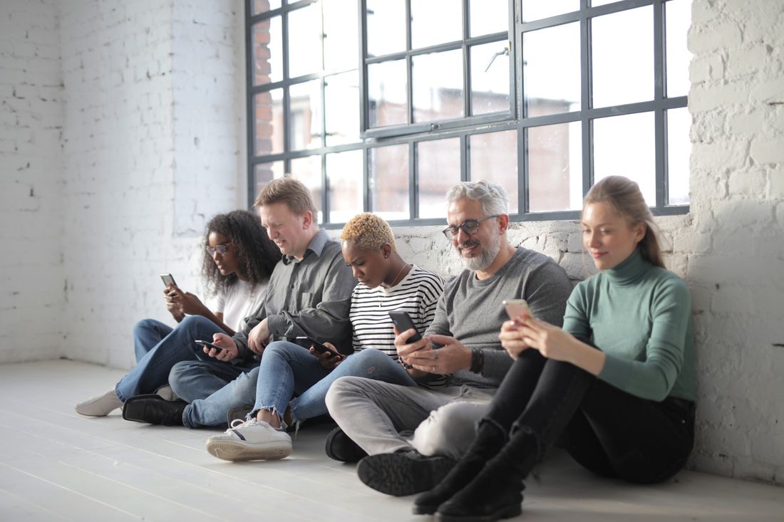 Several people each on their phones